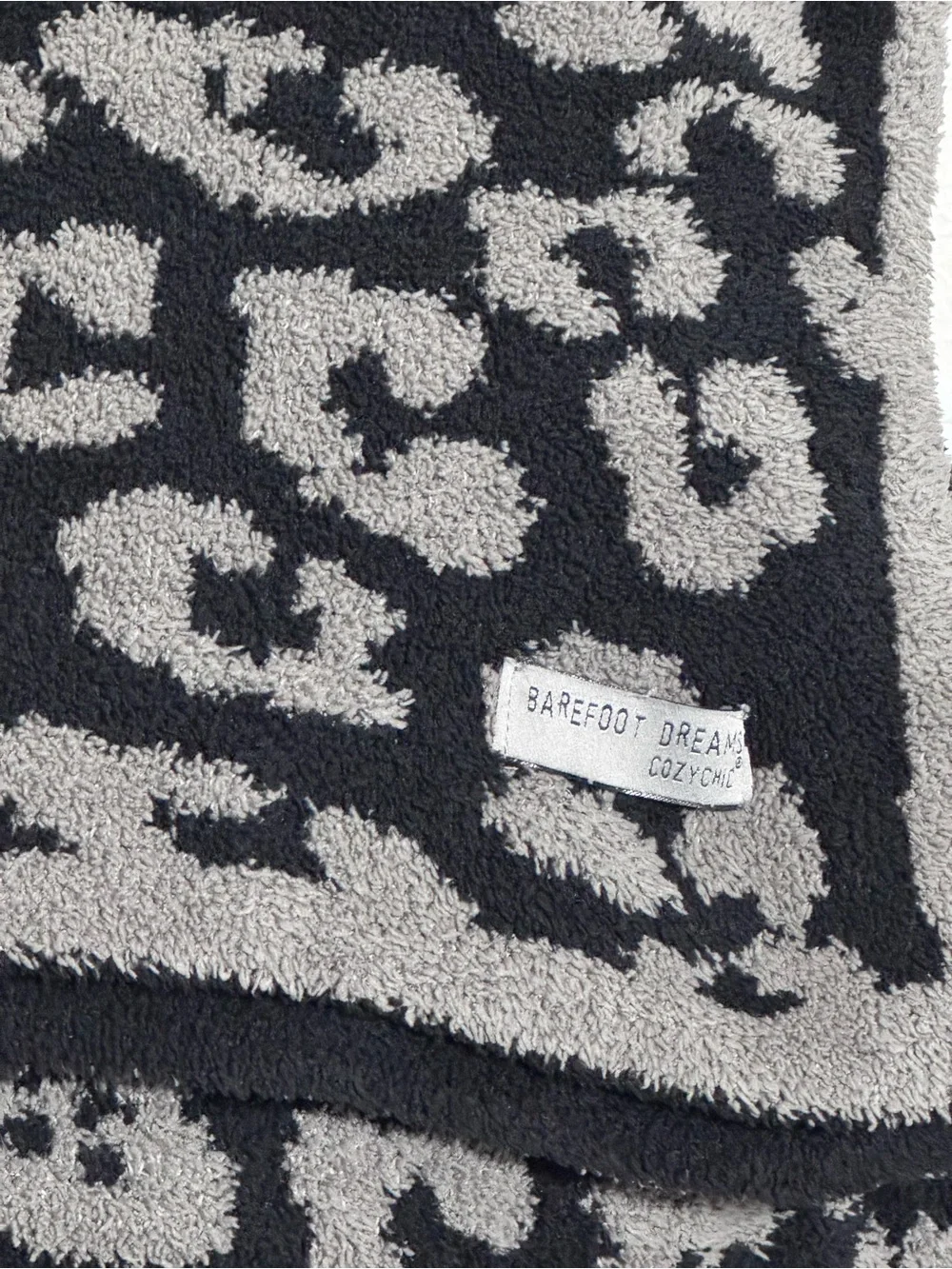 Barefoot Dreams CozyChic Barefoot in the Wild Throw Blanket in Charcoal Leopard